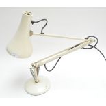 A white anglepoise lamp