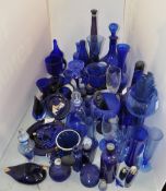 A group of assorted blue glassware