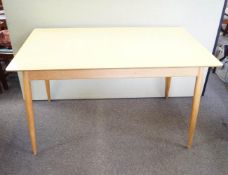 A formica topped kitchen table,