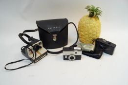 A Polaroid camera,