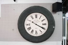 A large French wall clock, of round form,