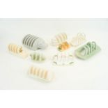 A group of assorted pottery toast racks