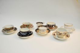 Seven 18th/19th century cups and saucers, being gilt and painted, to include Barr, Worcester,