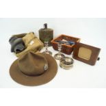 A WWII second World war gas mask in canvas carry case along with a RAR hat and other related items.