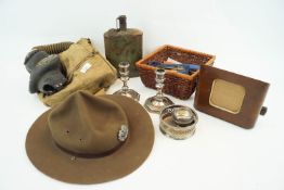 A WWII second World war gas mask in canvas carry case along with a RAR hat and other related items.