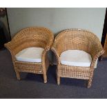 A pair of cane tub shaped chairs,