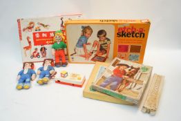 An early etch a sketch and other vintage toys