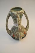 An Art Deco sessionist period vase, having four handles, with mottled design,