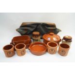 A group of assorted terracotta kitchen ware