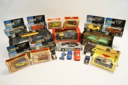 A quantity of boxed and other cars