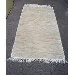 A modern rug, in wool, with wave designs,