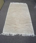 A modern rug, in wool, with wave designs,