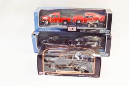 Two Maisto Special Edition Show Haulers series Cars and a Maisto Porsche Cayenne