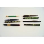 A group of fountain pens and others