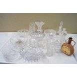 A collection of assorted cut glass and crystal bowls, vases,