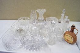A collection of assorted cut glass and crystal bowls, vases,
