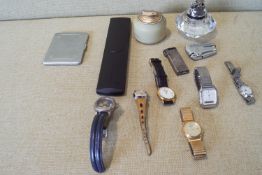 A group of assorted cigarette lighters and watches