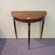A demi lune side table, in mahogany,