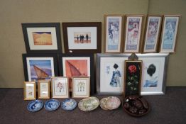 A group of prints and a wood fruit bowl,