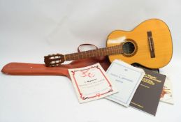 An acoustic guitar by Giannini,