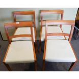 A set of four chairs with faux leather seats