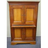 A mahogany bureau stationery cabinet with pull out desk and cupboard base,
