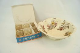 A boxed set of Babycham glasses and a bowl