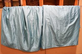 A pair of turquoise curtains
