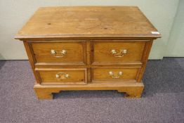 A small pine chests of drawers