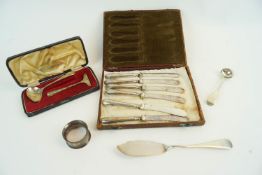 A silver spoon and pusher and other items