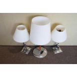 A pair of table lamps and another