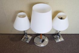 A pair of table lamps and another
