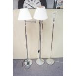 A pair of chrome standard lamps and another