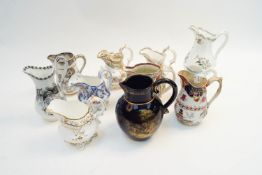 A collection of 19th century and later jugs, to include Gaudy Welsh,