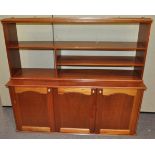 A mahogany finish sideboard and a hanging unit,