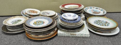 A collection of cabinet plates to include a Royal Doulton and others along with a blue and white