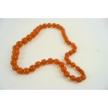 Vinatge graduated amber bakelite hand knotted necklace 30" Long