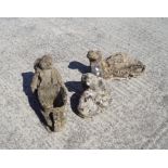 A group of composite stone garden figures,