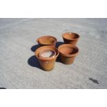 A group of terracotta plant pots