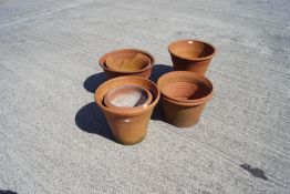 A group of terracotta plant pots