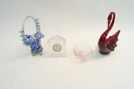 A glass swan and other items