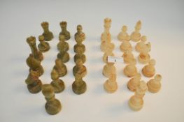 A turned variegated onyx chess set