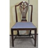 A mahogany camel back dining chair