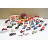 A group of boxed model cars and others