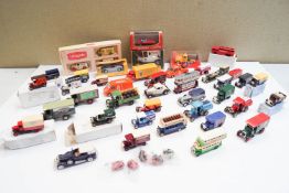 A group of boxed model cars and others
