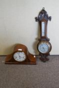 A Comitti mahogany cased mantel clock and an oak cased barometer