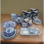 A collection of assorted blue and white pearlware plates, meat platters,