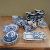 A collection of assorted blue and white pearlware plates, meat platters,
