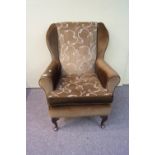 A 20th century fire side armchair.