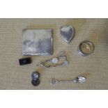 A silver cigarette case and other items